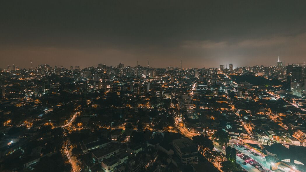 夜城全景鸟瞰，璀璨灯光下的天际线与建筑美景 - 4K高清壁纸下载