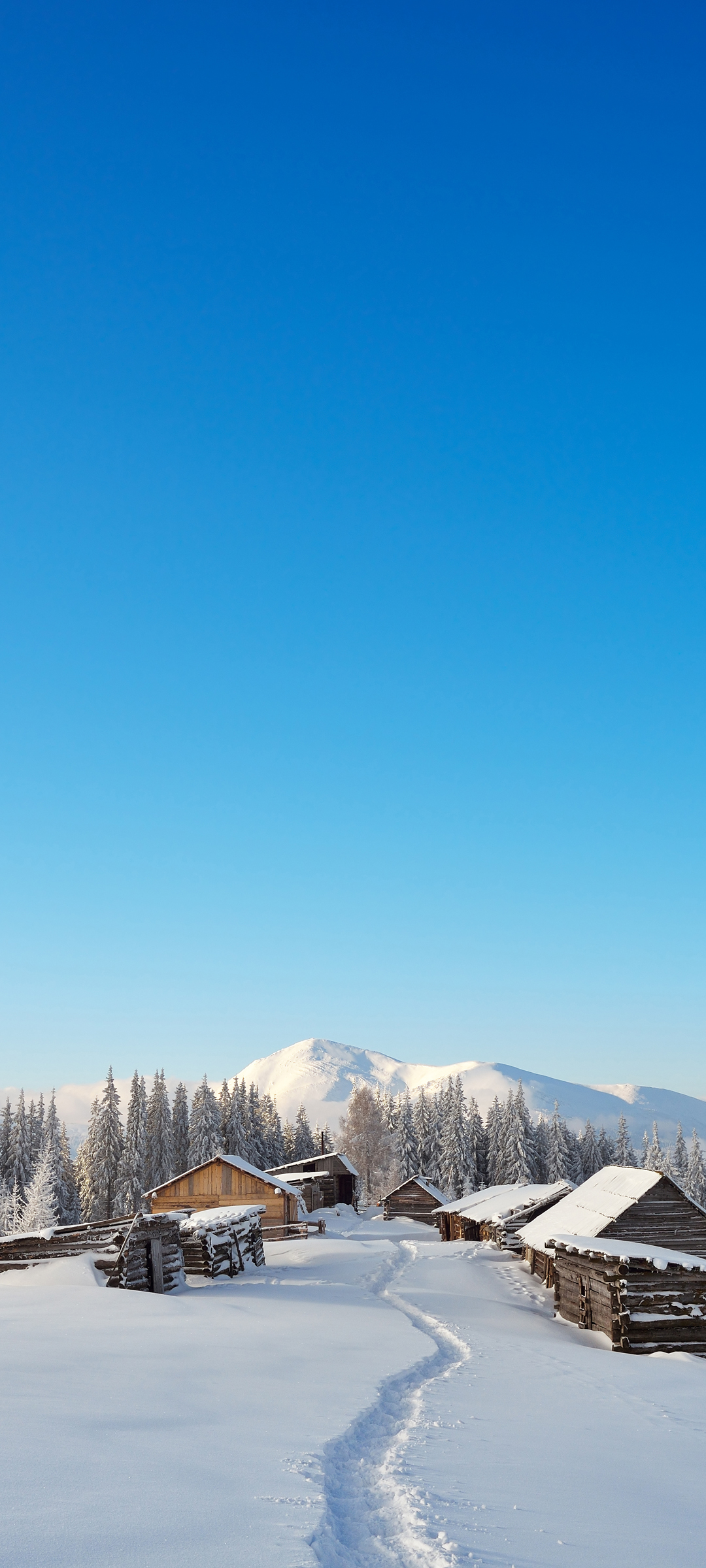 冬日雪景，脚印留痕，小木屋静立，雪山树林美景，免费手机壁纸下载