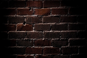 黑色砖头墙壁海报背景