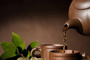 褐色茶杯茶壶茶叶背景